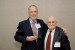 Dr. Nagib Callaos, General Chair, giving Dr. Russell Jay Hendel an award "In Appreciation for Delivering a Great Keynote Address at a Plenary Session."